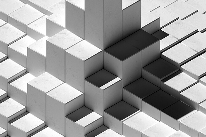 Meer von weißen Quadern, bei denen sich ein paar in der Mitte des Bildes zu einem Turm erheben